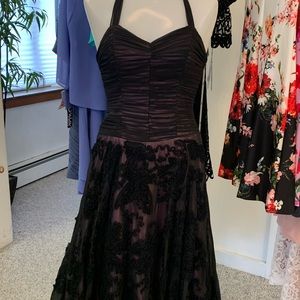 Sheer black lace dress over pink lining